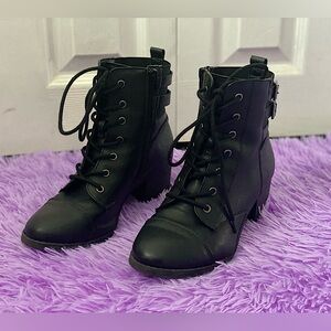 Black synthetic leather boots